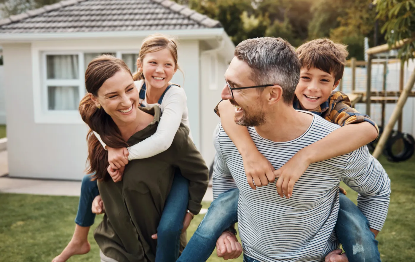 A family being shown through a bright, clean home
